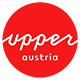 Logo Turistika v Horním Rakousku: červený kruh s bílým písmem upperaustria